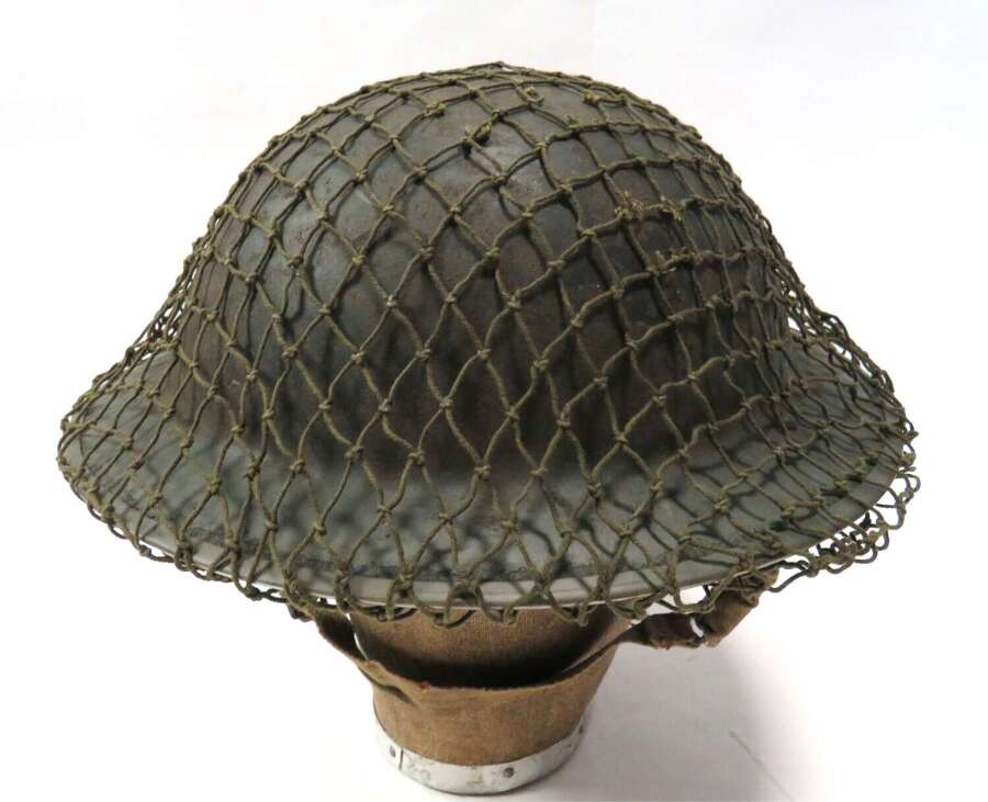 Early War Steel Helmet with camouflage Netting cover